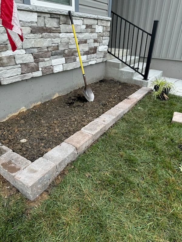 Stone-Raised Flower Bed Transformation